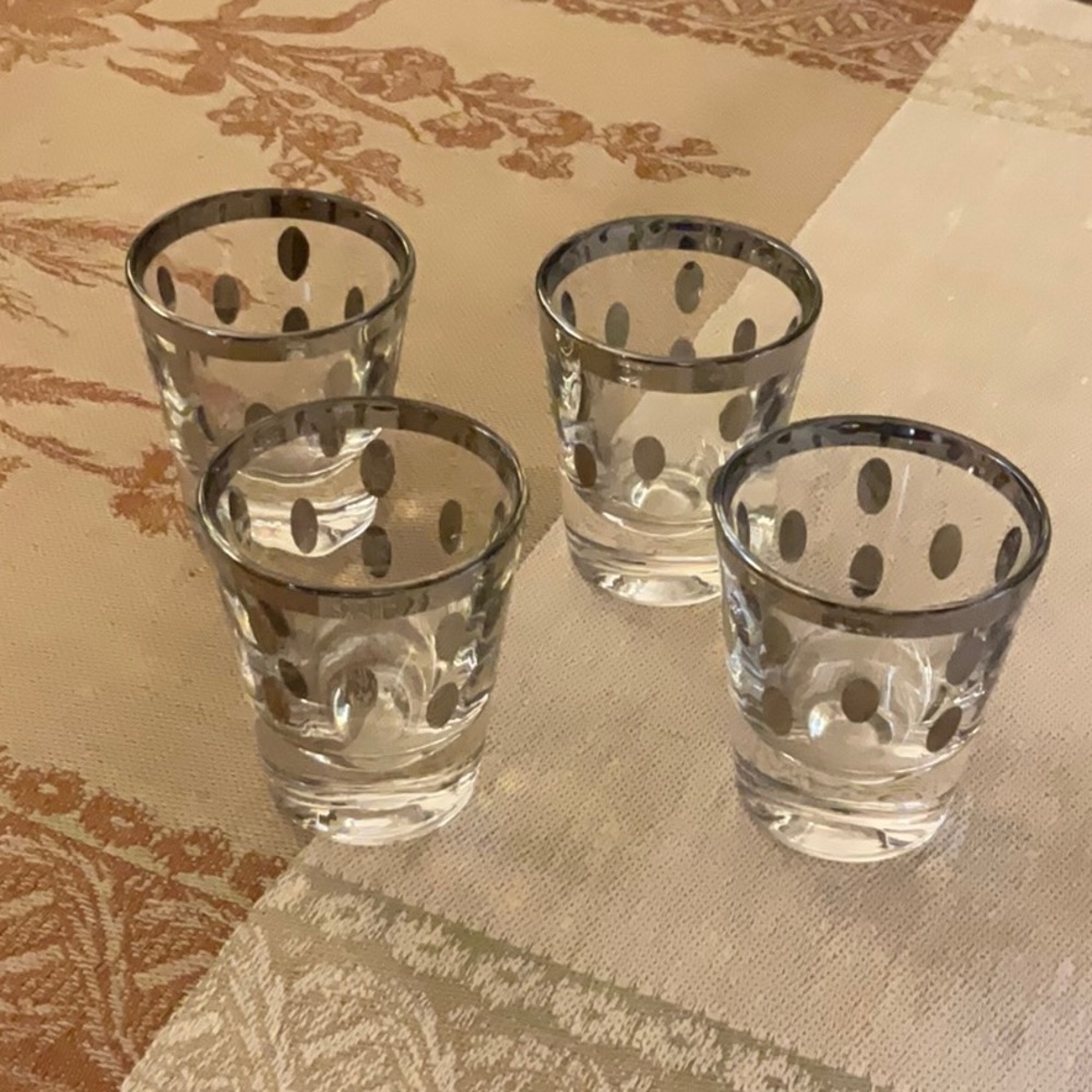 Set of 4 vintage shot glasses.  Awesome design and beautiful weight.  Mint!